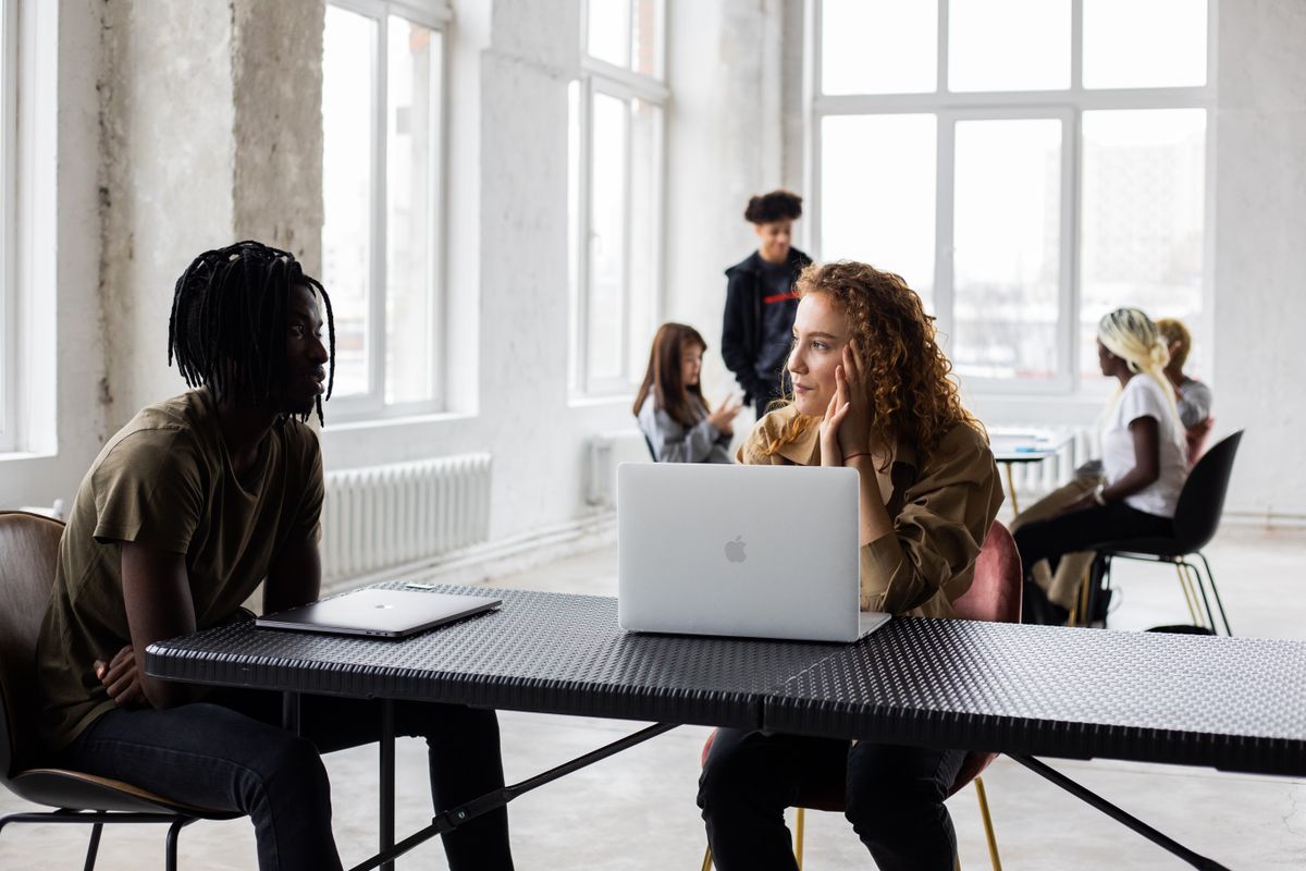 Diverse team collaborating in a bright, friendly workspace